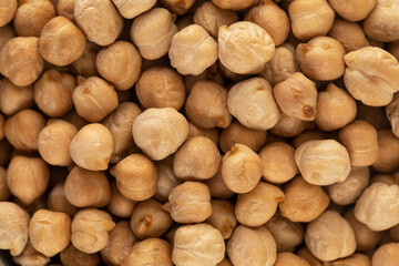 Raw chickpeas in full frame. The concept of vegetable protein. Horizontal frame. 