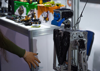 Man shaking hands with a robot