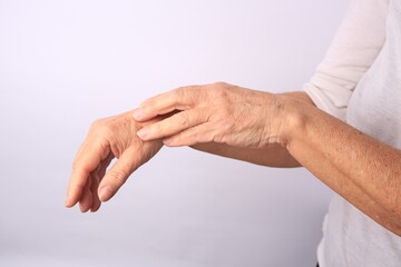 Closeup view of woman's hands with aging skin