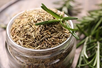Jar with dry and fresh rosemary, closeup