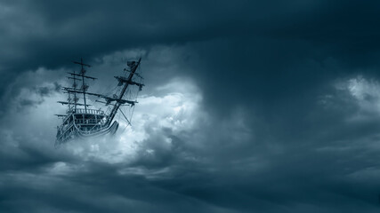 Flying old ship in the stormy clouds  - obrazy, fototapety, plakaty