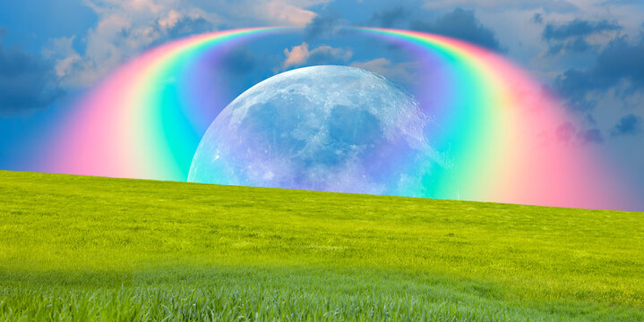 Beautiful landscape with green grass field, amazing rainbow over the moon in the background "Elements of this image furnished by NASA "