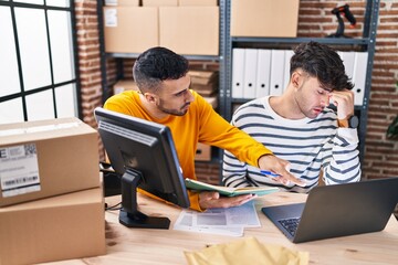 Two man ecommerce business workers with problem working at office