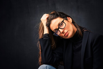 Attractive brunette haired woman studio portrait against at isolated background