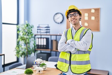 Hispanic man wearing architect hardhat happy face smiling with crossed arms looking at the camera. positive person.