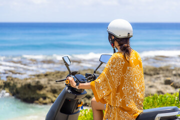 Travel Woman ride a motor bike in liuqiu island at Taiwan