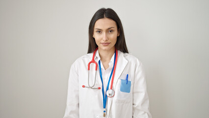 Young beautiful hispanic woman doctor standing with relaxed expression over isolated white background
