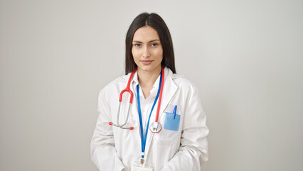 Young beautiful hispanic woman doctor smiling confident standing over isolated white background