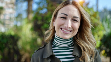 Young beautiful hispanic woman smiling confident at park