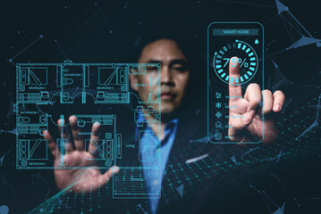 Man planning, managing various control systems,electronics devices in the house using blueprints through a virtual screen , smart home , Internet of Things Concept (IOT)