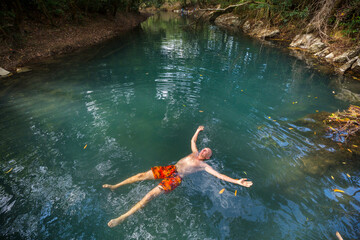 Man on tropical river