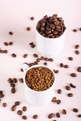 Choice between instant coffee and roasted coffee beans in cups on pink background vertical view