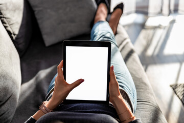 woman holding a tablet with blank screen concept for technology-based businesses, website design, and promotional campaigns, providing numerous opportunities for customization and inserting personali