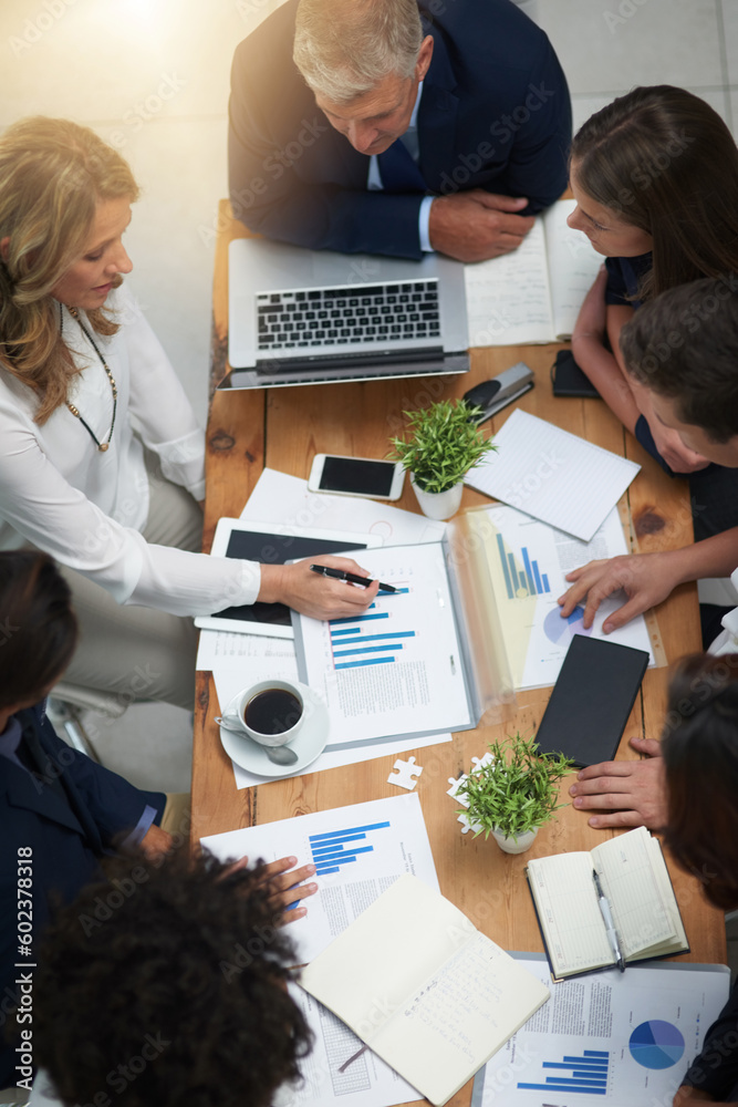Aufkleber Business people in meeting with team, tech and market research paperwork on table and analysis of graphs. Review information, data analytics and employees work together with top view of collaboration