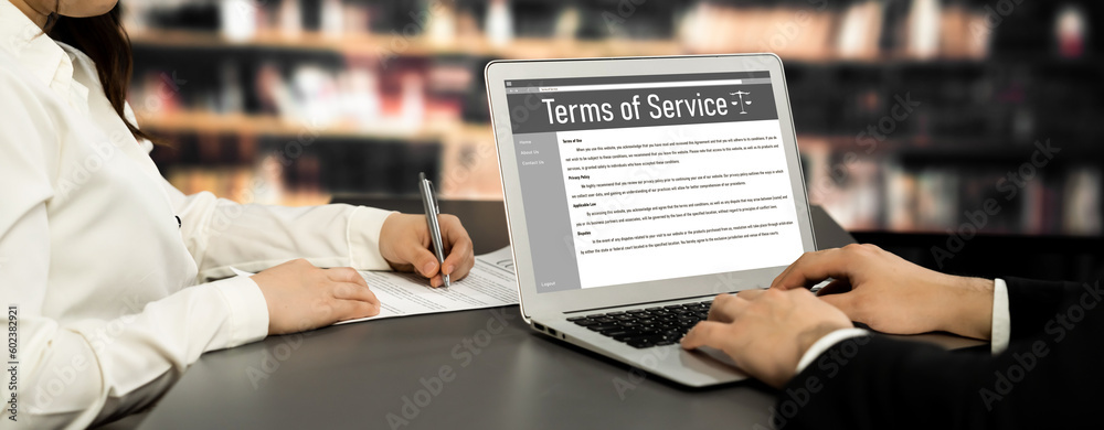 Poster online term of service conditions showing astute rules and regulations in using the website on a lap