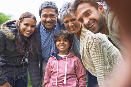 Selfie, nature and portrait of happy big family faces on an outdoor adventure and travel together. Love, smile and boy child taking picture with his grandparents and parents on holiday or vacation.
