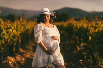 Portrait of Expecting Mother in Vineyard