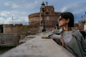 Beautiful young female with sunglasses in Rome Italy
