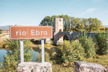 rio Ebro sign at the medieval bridge of Frías, Las Merindades, province of Burgos, Castile and León, Spain