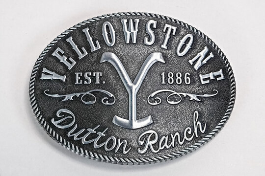 Display of  Changes Yellowstone Dutton Ranch Y Logo Belt Buckle in Studios shot.
