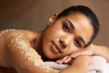 Portrait, body scrub or massage for woman to relax for resting or wellness physical therapy in spa....