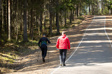 A fat man runs around the spring park.Outdoor activity.