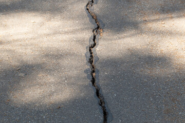 Crack on the asphalt.Old asphalt.Repair of asphalt pavement.