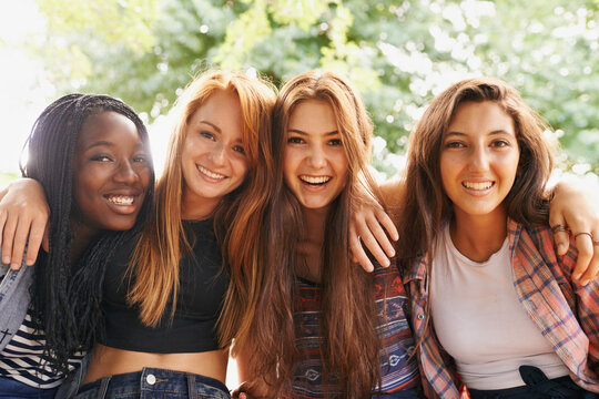 Girl friends, happy hug and portrait outdoor with diversity in group on holiday summer camp. Female student, sunshine and happiness face of young gen z and teen people together on vacation break