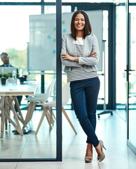 Portrait, business and woman with arms crossed, smile and startup success in a modern office. Face,...