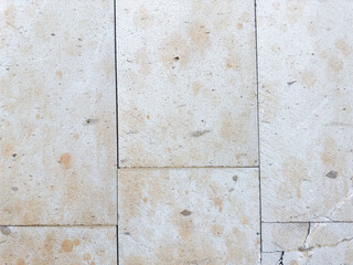 Modern stylish cream Italian natural sandstone surface background, close up, detail. Old vertical...