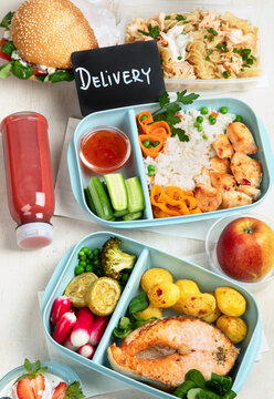 Restaurant healthy food delivery in take away boxes for daily nutrition on white background.