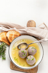 Knodel soup bowl and bread.