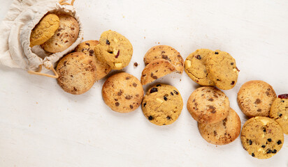 National Cookie Day with yummy freshly chocolate chip cookies on a white background. Top view.