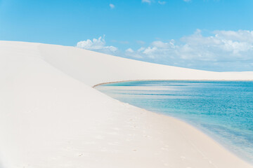 White sand dunes and turquoise water at Lençóis maranhenses national park Brazil