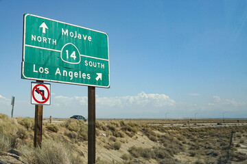 Interstate Highway Street Sign in Southern California's desert leading towards Los Angeles and...