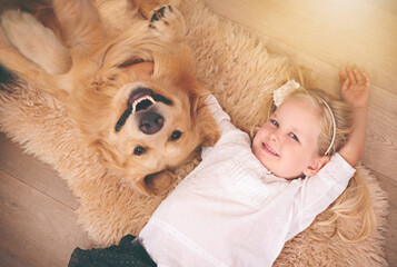 Girl, dog and portrait together on floor in living room or golden retriever, kid and smiling with...