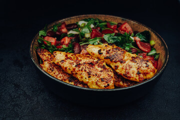 A salad with fried chicken