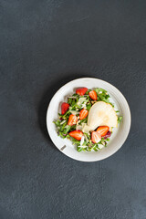 Homemade Italian arugula, pear and strawberry salad with pine nuts. Recipe from the chef. 