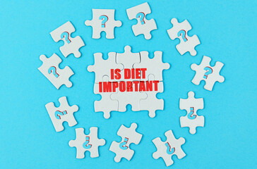 On a blue surface are puzzles with a question mark, in the center with the inscription - Is diet important