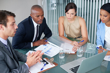 Strategy, teamwork and laptop with business people in meeting for idea, documents or learning. Collaboration, planning and leadership with employees in office for project management and brainstorming