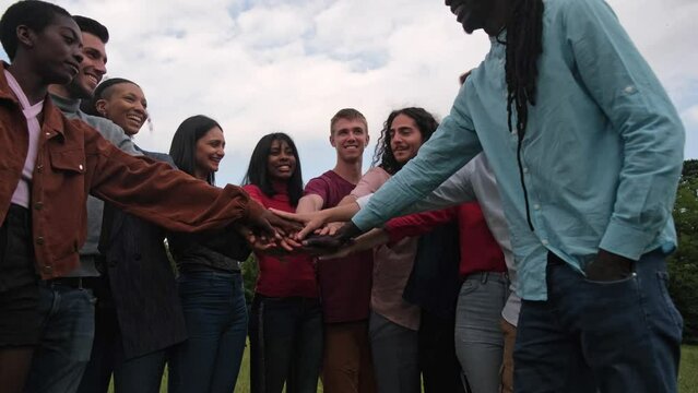 Group Of Young People From Different Countries Joining Hands To Work Together. Concept: Diversity, Lifestyle, Together