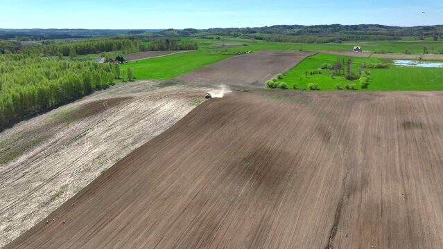 A drone view of the landscape of Warmia in the spring during field work, northern Poland, Europe