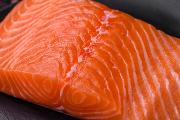 Fresh raw salmon red fish fillet with salt and spices