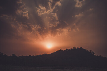 sunset in the mountains - beautiful sunset in the hills with clouds in the sky