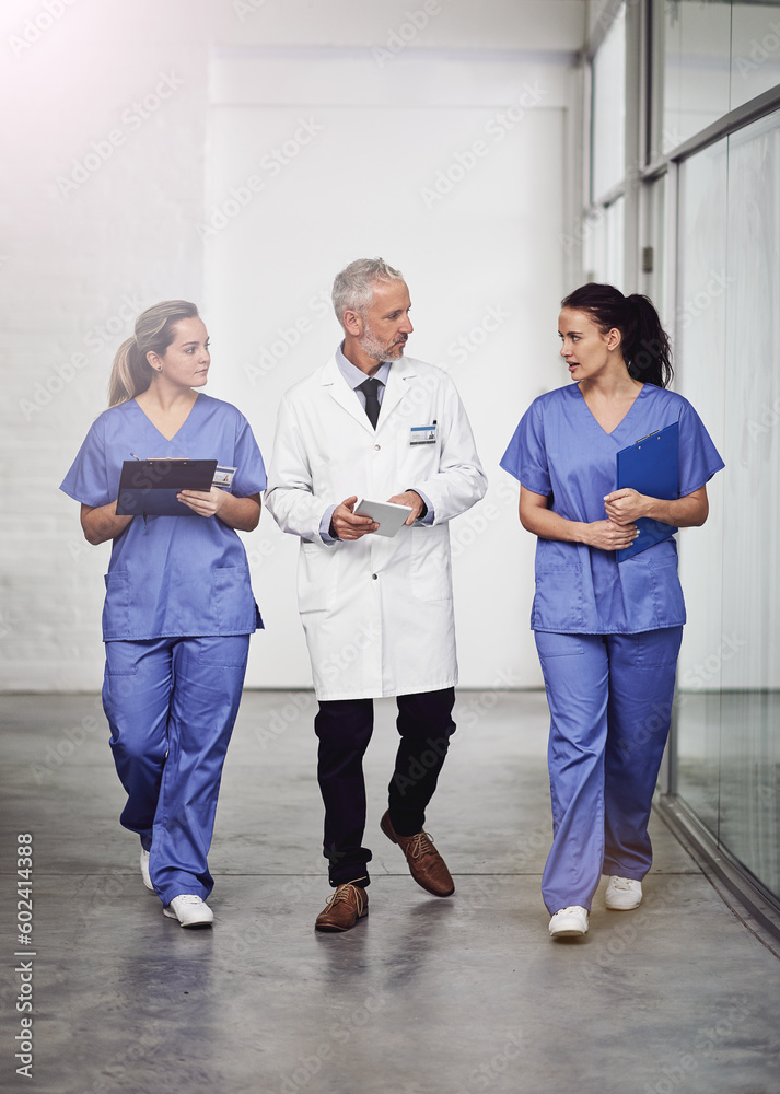 Canvas Prints Medical team, healthcare and doctors talking in a hospital with a clipboard and tablet for health insurance. Senior chief and nurses or a man and women together for a discussion, results and planning