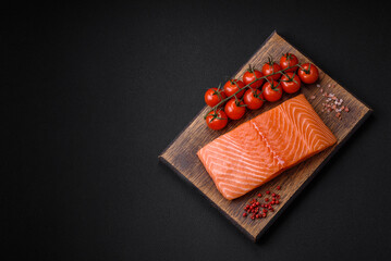 Fresh raw salmon red fish fillet with salt and spices