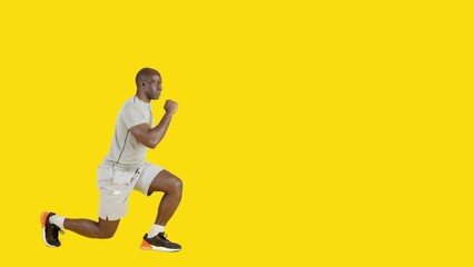 An african strong man doing knee lunge exercises