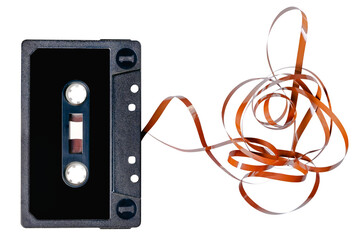 Old audio cassette with unrolled tape. Isolated background.