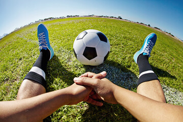 Sport, pov and shoes of man with soccer ball outdoor, relax and resting after fitness or training. Football, field and hands of male player relaxing on grass at park after workout, match or sports - obrazy, fototapety, plakaty