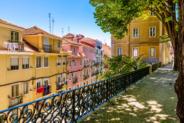 Lisbon, Portugal - April 24, 2023: Street perspective view with colorful traditional houses